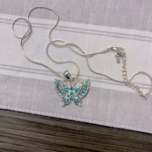 Gently used light blue butterfly necklace
